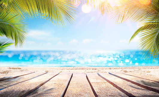 Empty Wooden Planks With Blur Beach And Sea On background - L'Absolu